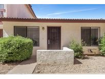 Charming single-story home featuring a secure front entrance and well-maintained landscaping at 15435 N 28Th St # 3, Phoenix, AZ 85032