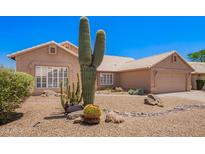 Charming home featuring desert landscaping and beautiful large cactus at 30645 N 44Th St, Cave Creek, AZ 85331