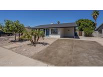Charming single-story home features desert landscaping, large driveway and inviting entryway at 3208 N El Dorado Dr, Chandler, AZ 85224