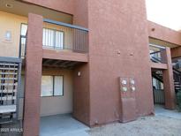 A view of the exterior of the building showing a covered patio and balconies at 3810 N Maryvale Pkwy # 1059, Phoenix, AZ 85031
