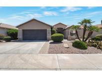 Charming single-story home featuring desert landscaping and a two-car garage at 3925 N 160Th Ave, Goodyear, AZ 85395