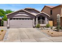 Charming single-story home featuring a well-maintained yard and a convenient two-car garage at 4704 E Melinda Ln, Phoenix, AZ 85050