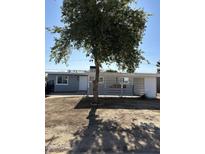 Charming single-story home with large front yard and a mature shade tree at 5029 W Osborn Rd, Phoenix, AZ 85031