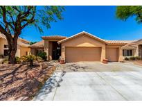 Charming home with a well-manicured front yard and a spacious three-car garage at 5912 W Gail Dr, Chandler, AZ 85226