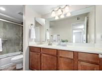 Bathroom featuring a large mirror, well-lit vanity, and combined shower-tub at 8787 E Mountain View Rd # 1087, Scottsdale, AZ 85258