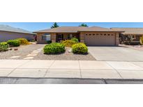 Charming single story home features desert landscaping and a spacious two-car garage at 11523 E Lindner Ave, Mesa, AZ 85209