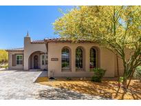 Charming home featuring arched windows, desert landscaping, and a tiled roof at 12325 S 179Th Ave # 29, Goodyear, AZ 85338