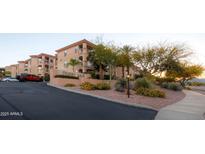Charming condo community with mature landscaping, a stucco exterior, and a Desert Sage sign at 16631 E El Lago Blvd # 208, Fountain Hills, AZ 85268