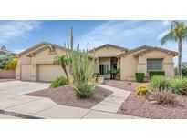 Charming single-story home featuring desert landscaping and a two-car garage at 4239 W Reddie Loop, Phoenix, AZ 85083