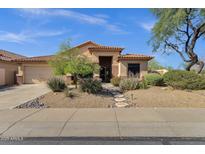 Charming single-story home with desert landscaping, tile roof, and covered entry at 4338 E Hamblin Dr, Phoenix, AZ 85050
