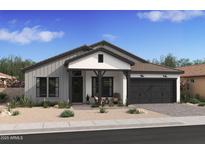 Charming single-story home featuring a gray exterior, dark accents, and a welcoming front porch with rocking chairs at 667 E Brown Way, San Tan Valley, AZ 85140
