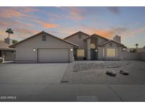 Charming single-story home featuring desert landscaping and a two-car garage at 7253 S Terrace Rd, Tempe, AZ 85283
