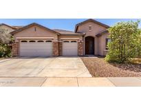 Charming single-Gathering home with a three-car garage and a well-manicured yard at 1955 E Grand Canyon Dr, Chandler, AZ 85249