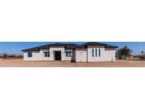 Beautiful single Gathering home featuring a modern design, desert landscaping, and dark accents on the roof and windows at 2689 S 305Th Ave Ave, Buckeye, AZ 85326
