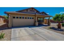 Charming single-story home featuring a well-maintained lawn and attached two-car garage at 3221 W Alta Vista Rd, Phoenix, AZ 85041