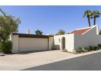 Charming home featuring a two-car garage, desert landscaping, and a tile roof at 5622 N Palacio Way, Phoenix, AZ 85014