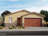 Inviting one-story home featuring a two-car garage, stone accents, and a well-manicured front yard at 9103 N 173Rd Ln, Waddell, AZ 85355