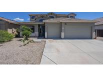Charming home featuring a two-car garage, desert landscaping, and a tile roof on a sunny day at 18174 E Via Jardin --, Gold Canyon, AZ 85118