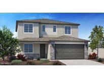 Charming two-story home featuring stone accents and a well-manicured front yard at 4920 W Walatowa St, Laveen, AZ 85339