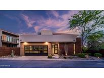 Stunning modern home featuring a glass garage door and desert landscaping at 6525 E Cave Creek Rd # 40, Cave Creek, AZ 85331