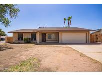 Charming single-story home features a two-car garage and low-maintenance front yard at 18402 N 17Th Ave, Phoenix, AZ 85023
