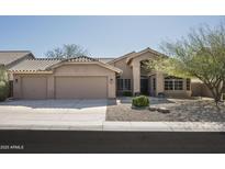 Charming single Gathering home with a three car garage and low maintenance desert landscaping at 18873 N 94Th Way, Scottsdale, AZ 85255