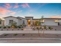 Beautiful single-story home featuring a well-manicured front yard and neutral color palette at 20426 E Arroyo Verde Dr, Queen Creek, AZ 85142