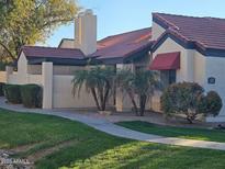 Inviting home exterior with red tile roof, desert landscaping, and a well-maintained lawn at 2123 E Kirkland Ln # 3, Tempe, AZ 85281