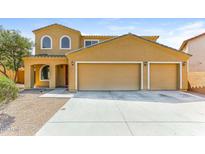 Inviting two-story home with a three car garage and charming curb appeal at 2129 E Yuma Ave, Apache Junction, AZ 85119