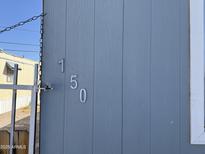 Exterior features the house numbers 150 on the side of the home at 235 W Southern Ave # 150, Mesa, AZ 85210