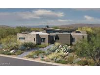 Contemporary home featuring stone and wood accents, with desert landscaping adding natural beauty at 38026 N 114Th Way # 32, Scottsdale, AZ 85262