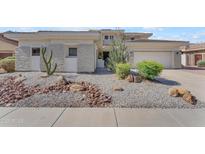Charming single Gathering home with desert landscaping and a two-car garage at 3806 E Taurus Pl, Chandler, AZ 85249