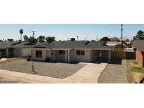 Charming single-story home with a well-maintained front yard and a covered parking area at 4219 W Citrus Way, Phoenix, AZ 85019