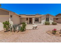 Inviting home exterior featuring a well-maintained yard and solar panels at 916 W Loughlin Dr, Chandler, AZ 85225