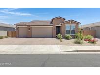 Charming single-story home featuring a three-car garage and well-maintained landscaping at 1221 E Jahns Dr, Casa Grande, AZ 85122