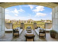 Expansive covered balcony with golf course views, stylish seating, and lounge chairs, ideal for relaxing and entertaining at 2 Biltmore Est # 313, Phoenix, AZ 85016