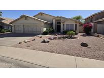 Charming home featuring a low maintenance desert landscape and a three car garage at 2629 E Verbena Dr, Phoenix, AZ 85048