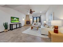 Inviting living room features a cozy fireplace, comfortable seating, and stylish decor at 36601 N Mule Train Rd # 45B, Carefree, AZ 85377