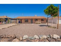 Charming single-story home featuring desert landscaping and a cozy covered front porch at 4545 N 49Th Ave, Phoenix, AZ 85031