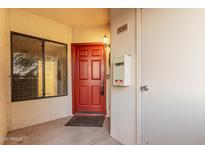 Inviting condo front door with red paint, dark hardware, and covered porch at 750 E Northern Ave # 2045, Phoenix, AZ 85020