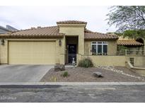 Charming single-story home featuring a tan exterior, tile roof, and a well-maintained front yard at 943 E Kortsen Rd # 2, Casa Grande, AZ 85122