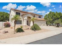 Charming two-story home with a three-car garage and desert landscaping at 12748 N 57Th Dr, Glendale, AZ 85304