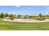 Scenic view of the community park with a water feature, ample green space, and a large event staging area at 14910 N Kings Way # 206, Fountain Hills, AZ 85268