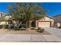 Charming single-Gathering home with desert landscaping, stone accents, and a two-car garage at 16758 W Apache St, Goodyear, AZ 85338