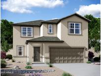 Charming two-story home with a manicured front yard and a two-car garage at 32218 N Knauss Ln, San Tan Valley, AZ 85143