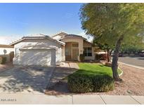 Charming single-story home featuring desert landscaping and a two-car garage at 351 S Apache Dr, Chandler, AZ 85224