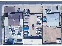 Aerial view of property showing buildings, parking and surrounding neighborhood at 1039 E Broadway Rd, Mesa, AZ 85204