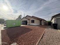 Cozy single story home with attached garage and low maintenance desert landscaping at 1546 W Vaughn Ave, Gilbert, AZ 85233