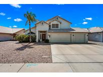 Charming two-story home featuring a spacious three car garage and a lushly landscaped yard at 1638 N Avoca --, Mesa, AZ 85207