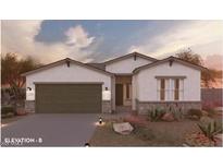 Charming single-story home featuring a two-car garage and desert landscaping at 17545 N Bolerno Dr, Maricopa, AZ 85138